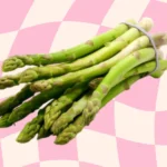 Fresh asparagus spears being blanched and frozen for long-term storage.