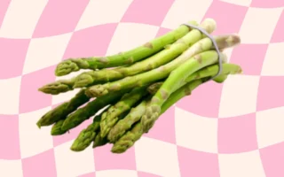 Fresh asparagus spears being blanched and frozen for long-term storage.